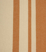 Close-up of cream fabric with warm terracotta woven stripes and a natural textured finish.