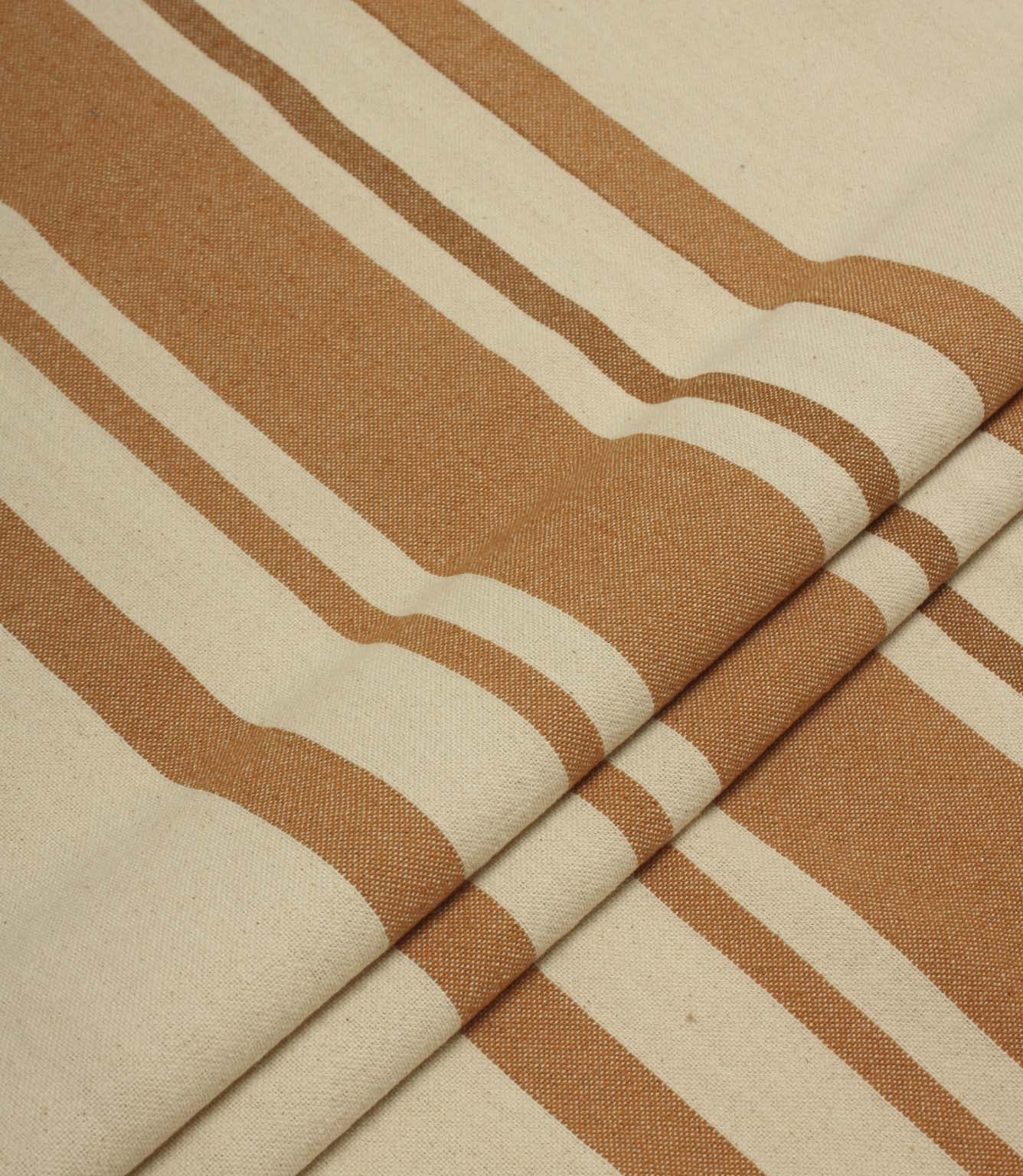 Folded cream and terracotta striped upholstery fabric with a soft drape and textured woven surface.