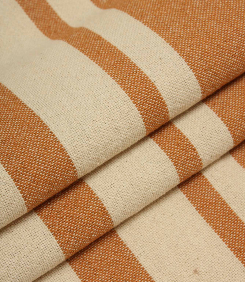 Gathered cream and terracotta striped fabric highlighting the bold stripe design and relaxed woven texture.