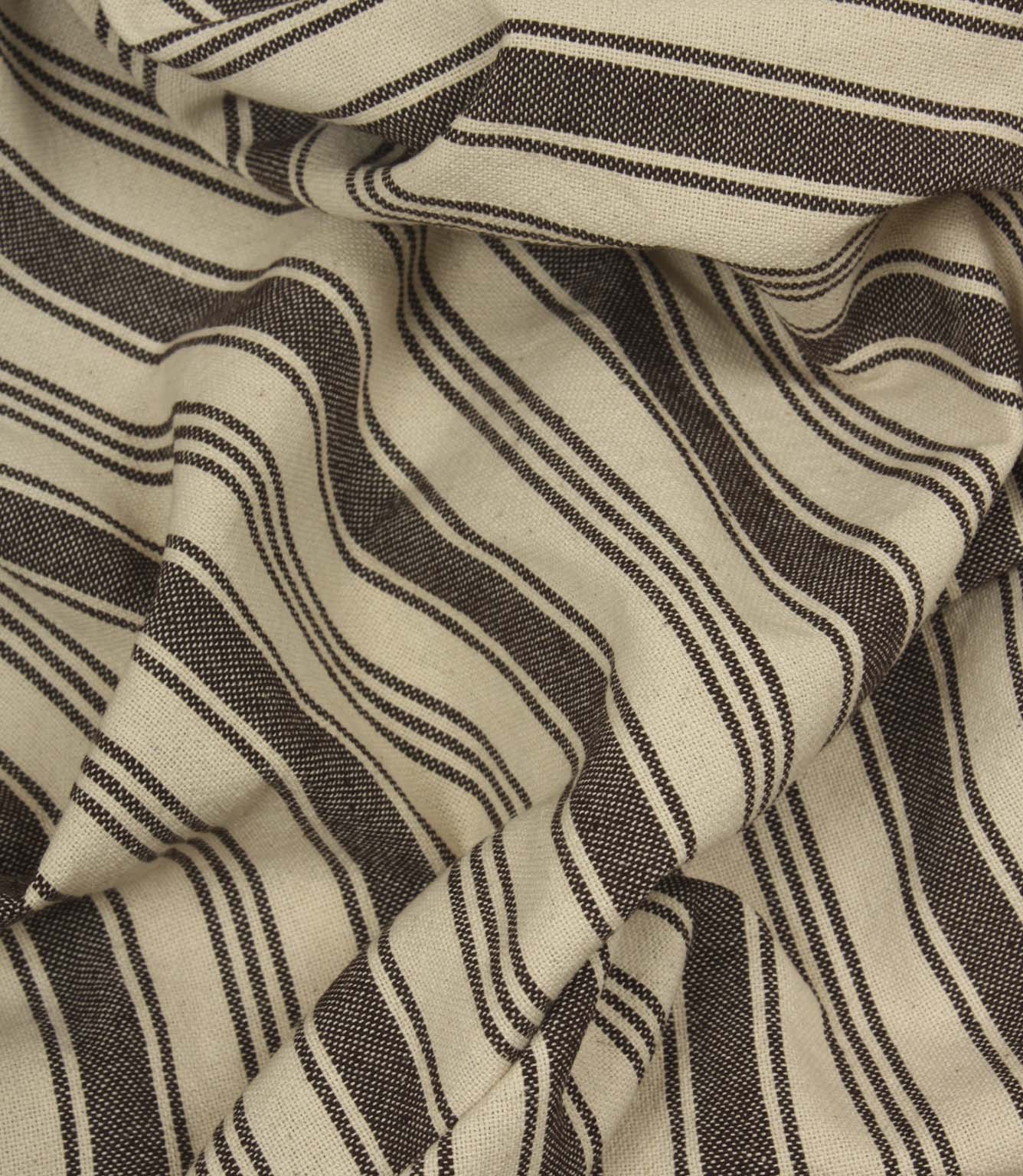 Gathered cream and dark brown striped fabric highlighting the relaxed drape and timeless woven stripe design.