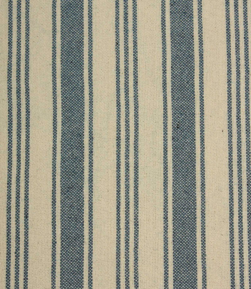 Close-up of blue striped upholstery fabric with textured weave detail, combining bold denim-blue stripes and narrow pinstripes on a natural cream background.