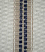 Close-up of Alma Stripe Marina fabric showing the textured woven construction with twin navy blue stripes, natural beige detailing and an off-white ground.