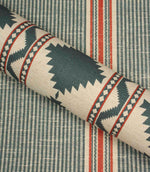 Roll of fabric with geometric pattern on a striped background