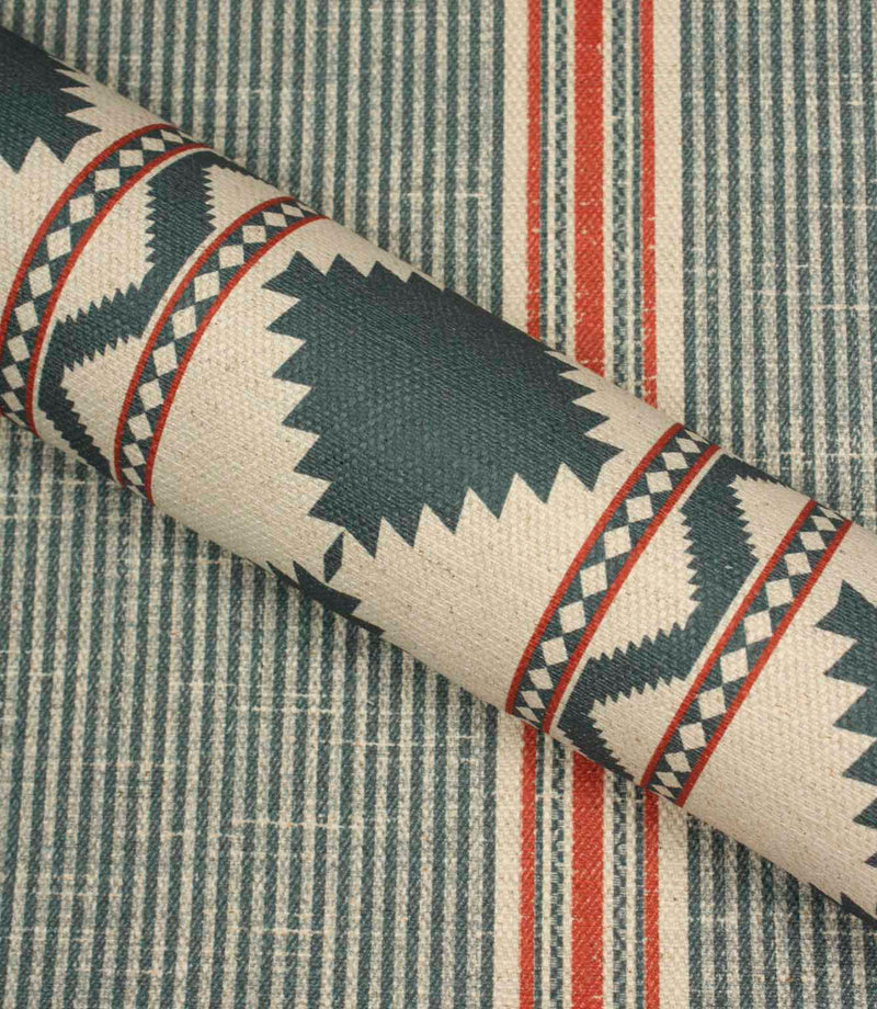 Roll of fabric with geometric pattern on a striped background