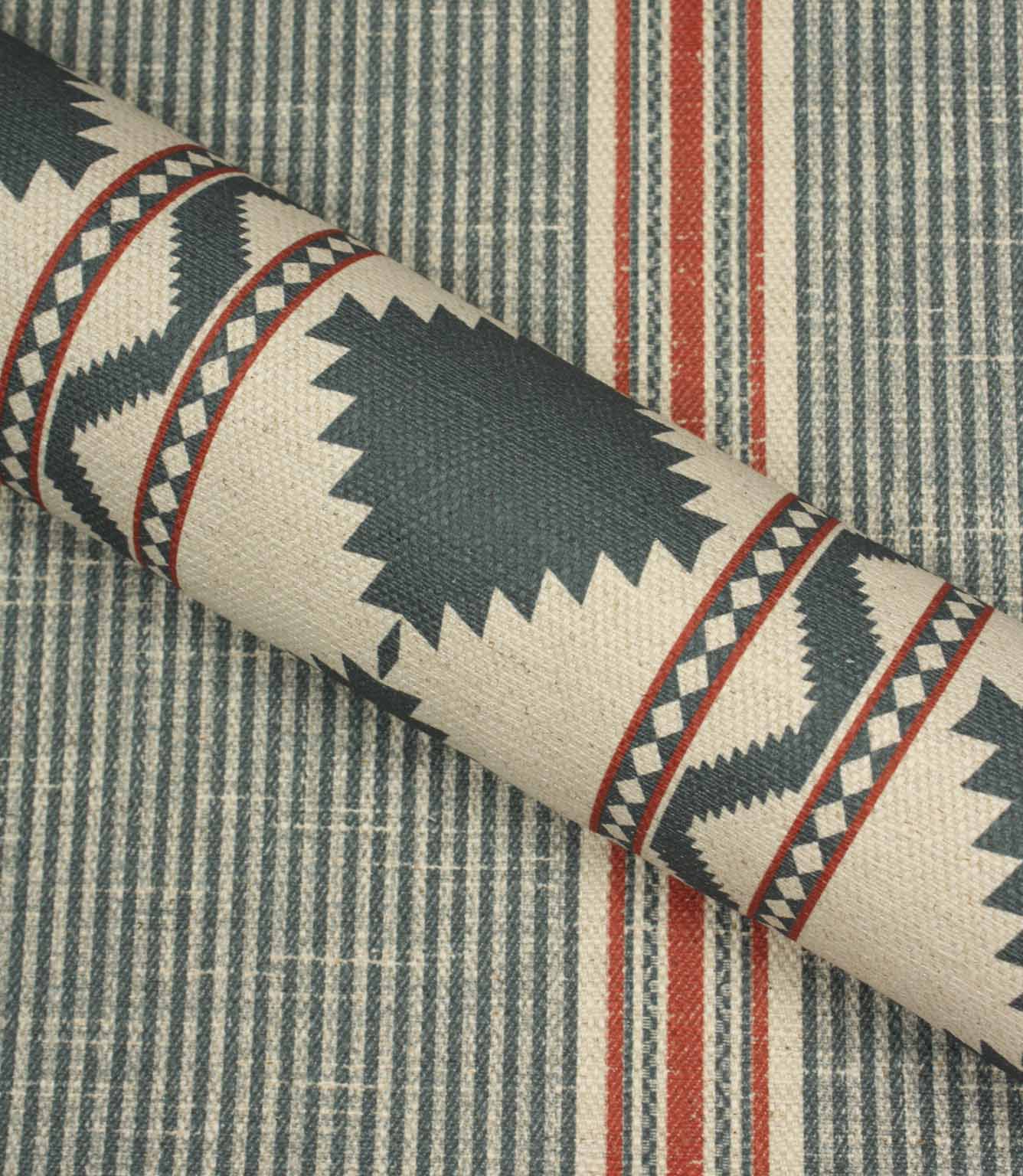 Roll of fabric with geometric pattern on a striped background