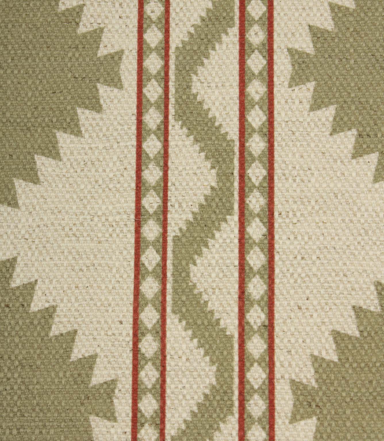 Close-up of sage and cream geometric fabric showing textured woven detail, featuring tribal-style diamond shapes and red accent stripes.