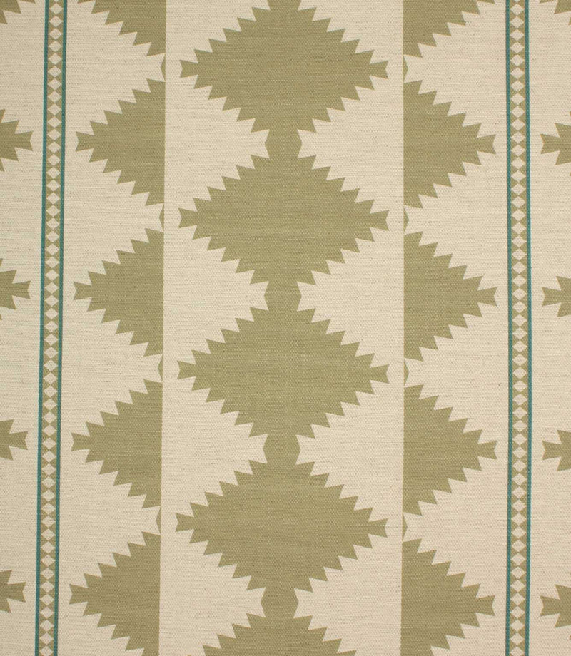 Patterned fabric with green geometric design on a beige background