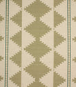 Patterned fabric with green geometric design on a beige background