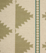 Close-up of a patterned fabric with geometric design on a beige background