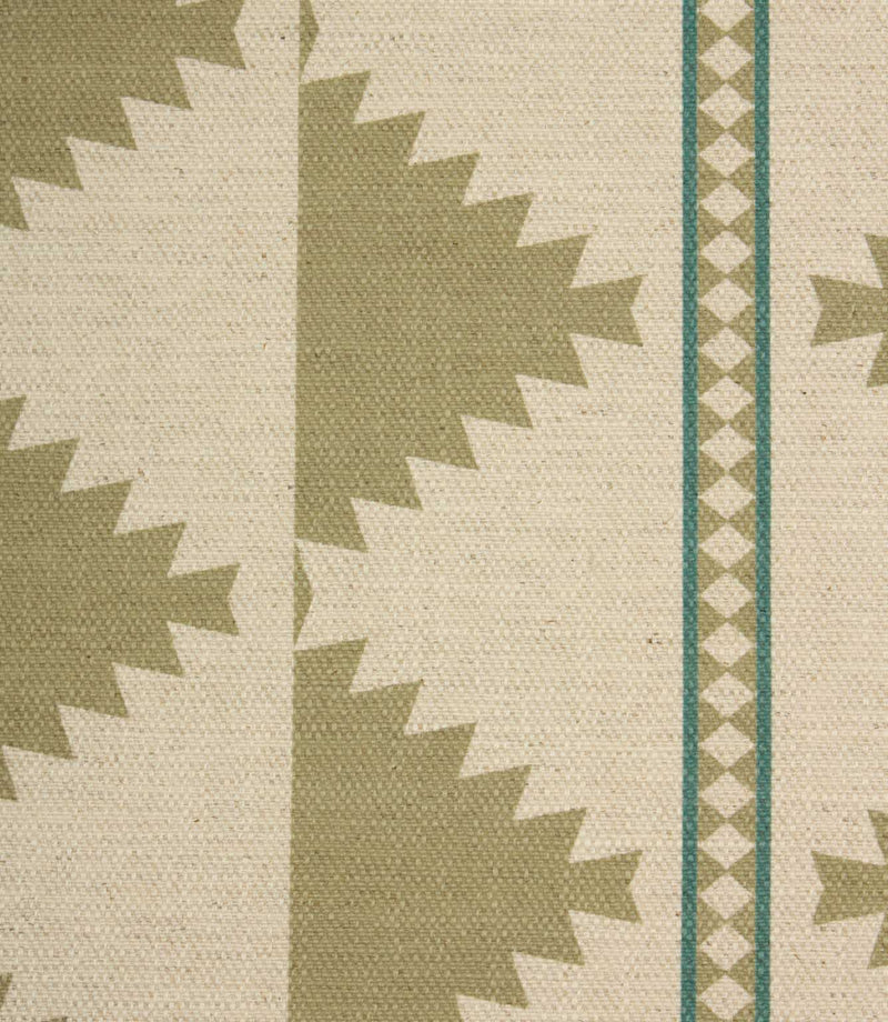Close-up of a patterned fabric with geometric design on a beige background