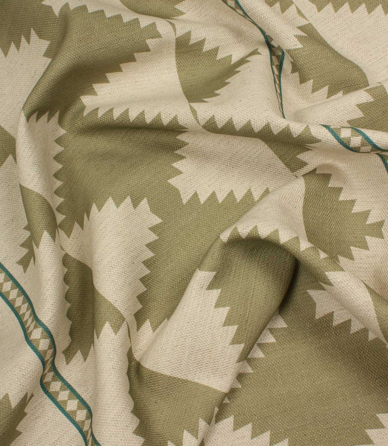 Fabric with a geometric pattern in green and beige tones