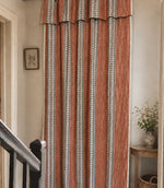 Striped curtain with a subtle geometric pattern fabric.