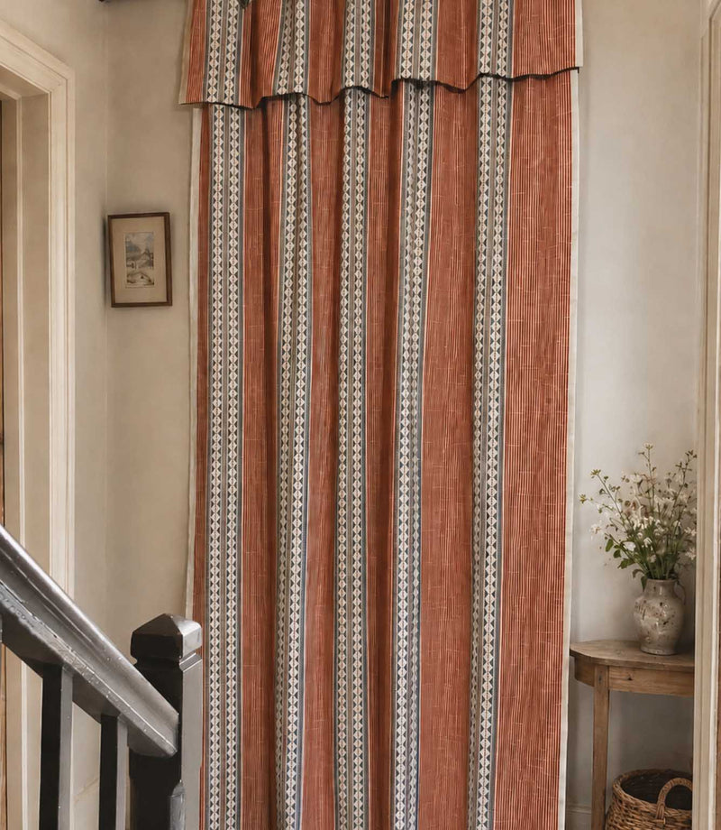 Striped curtain with a subtle geometric pattern fabric.
