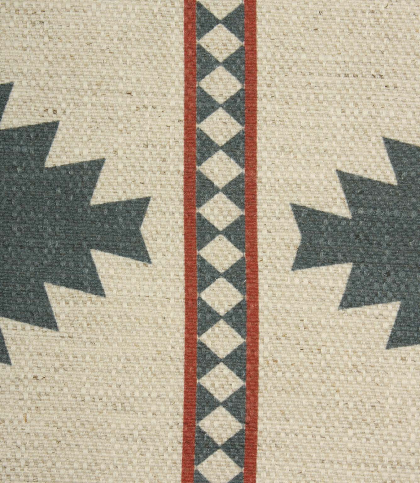 Close-up of cream textured fabric with teal geometric detailing and narrow rust red striped borders showing the woven surface and printed pattern.