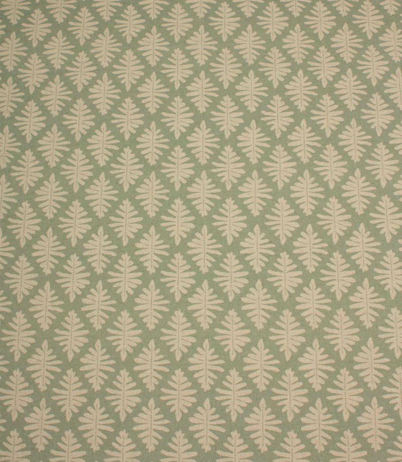 Ashleaf Dill fabric with a repeating cream leaf motif on a soft sage green background.