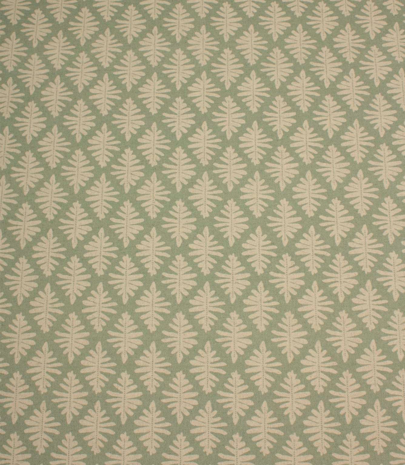 Ashleaf Dill fabric with a repeating cream leaf motif on a soft sage green background.