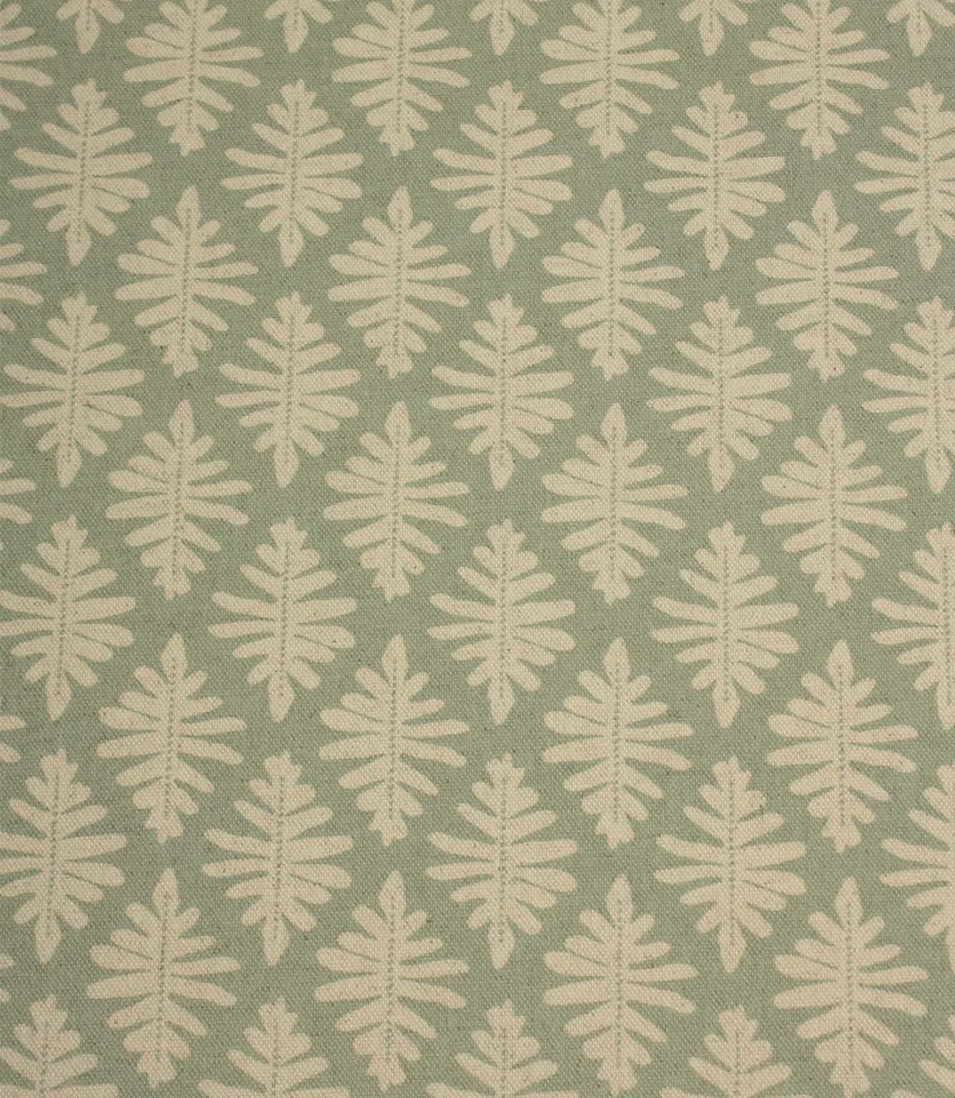 Close-up of Ashleaf Dill fabric showcasing the woven texture and stylised cream leaf design.