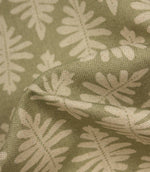Close-up of Ashleaf Lemon Grass fabric showing the woven construction and stylised foliage detail.