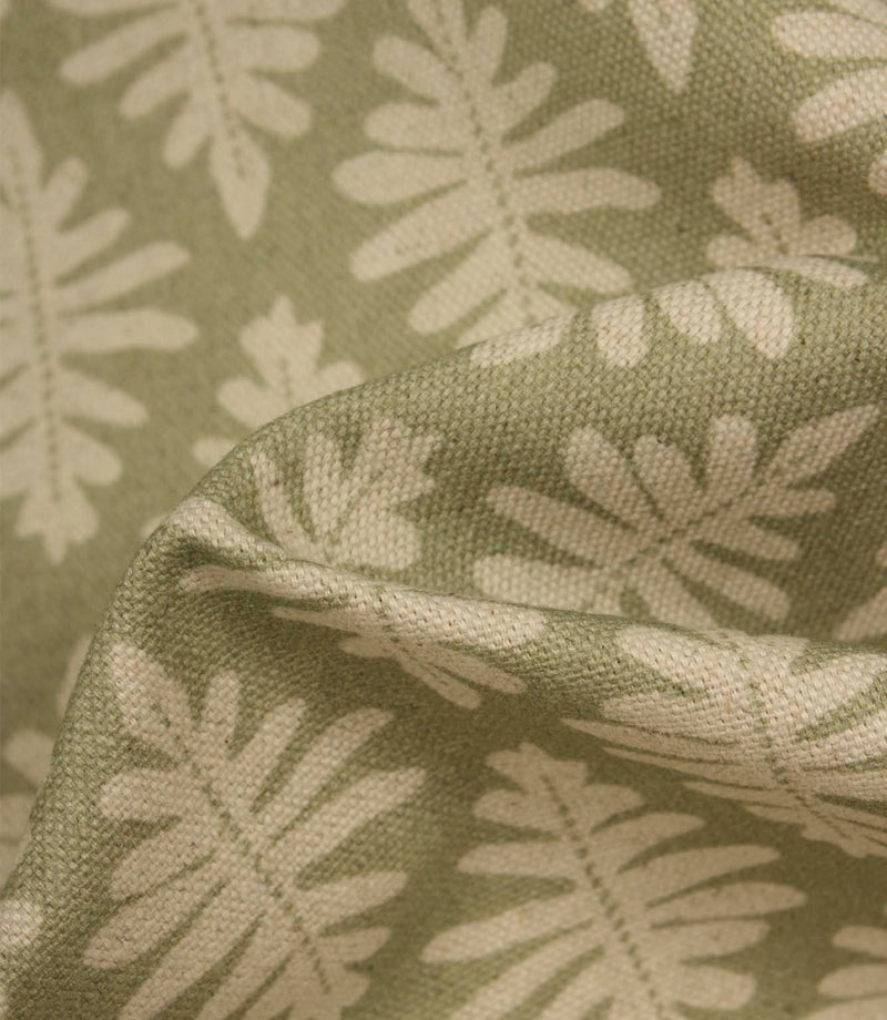 Close-up of Ashleaf Lemon Grass fabric showing the woven construction and stylised foliage detail.