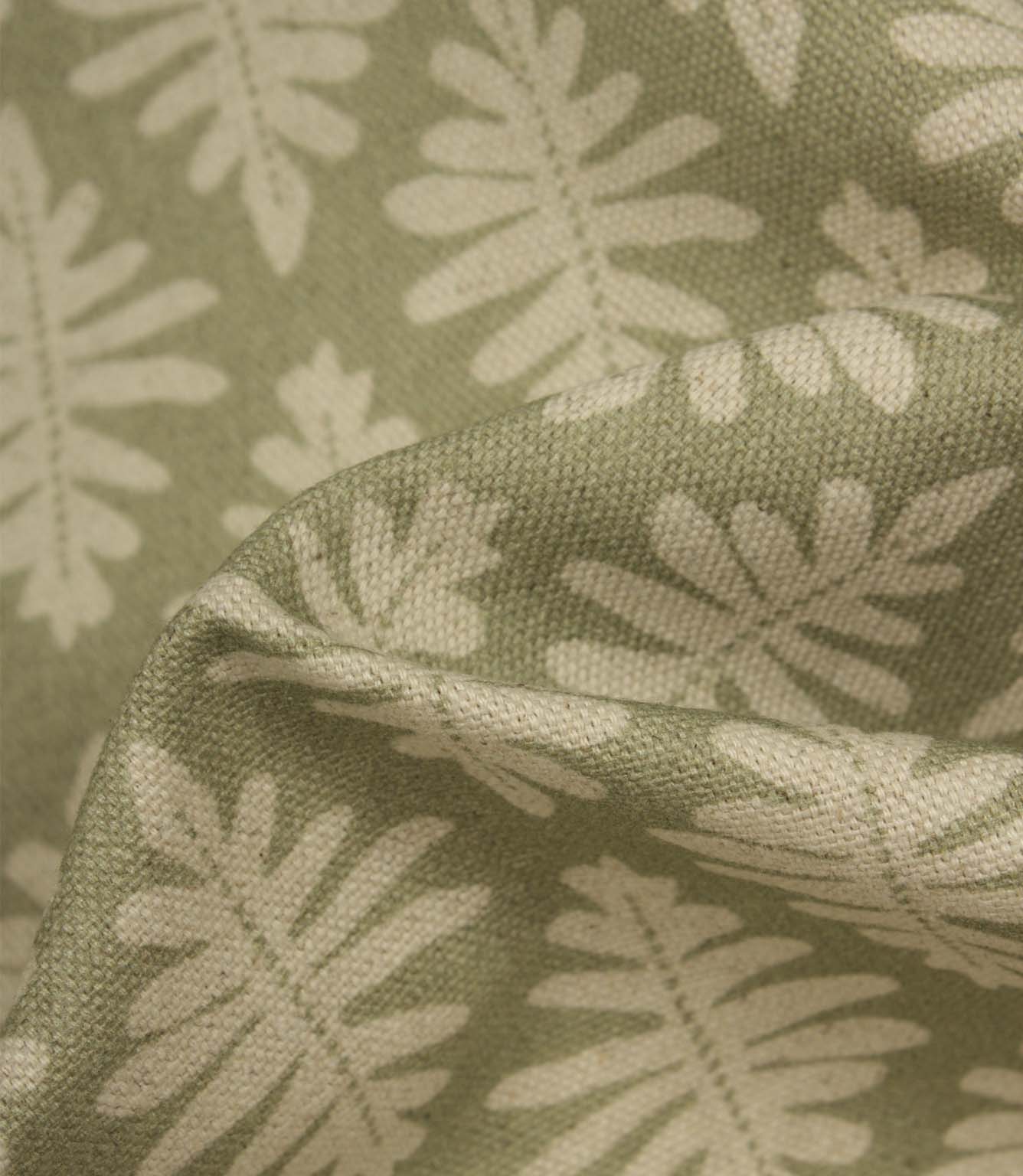 Close-up of Ashleaf Lemon Grass fabric showing the woven construction and stylised foliage detail.
