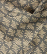 Draped Ashleaf Monsoon fabric displaying the repeating botanical pattern, ideal for curtains, blinds and cushions.