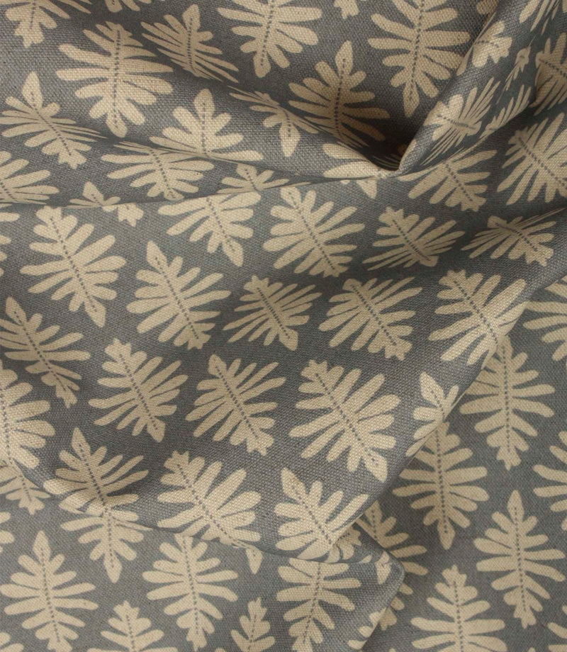 Draped Ashleaf Monsoon fabric displaying the repeating botanical pattern, ideal for curtains, blinds and cushions.