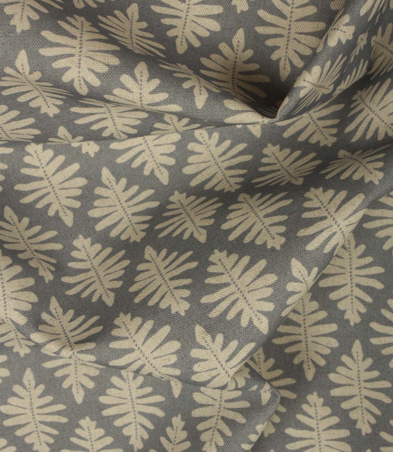 Draped Ashleaf Monsoon fabric displaying the repeating botanical pattern, ideal for curtains, blinds and cushions.