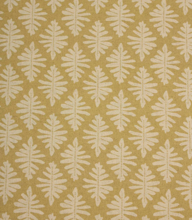 Close-up of Ashleaf Pesto fabric showcasing the woven texture and contemporary leaf motif.