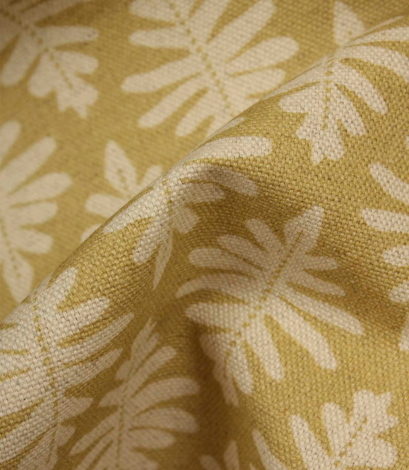 Close-up of Ashleaf Pesto fabric showing the woven construction, texture and stylised foliage detail.