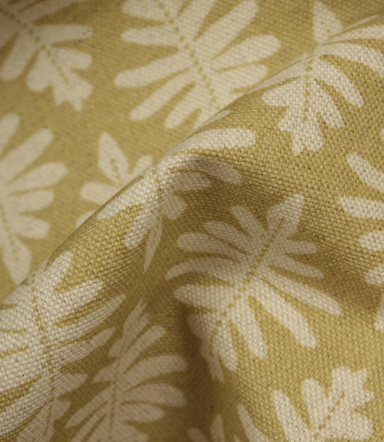 Close-up of Ashleaf Pesto fabric showing the woven construction, texture and stylised foliage detail.
