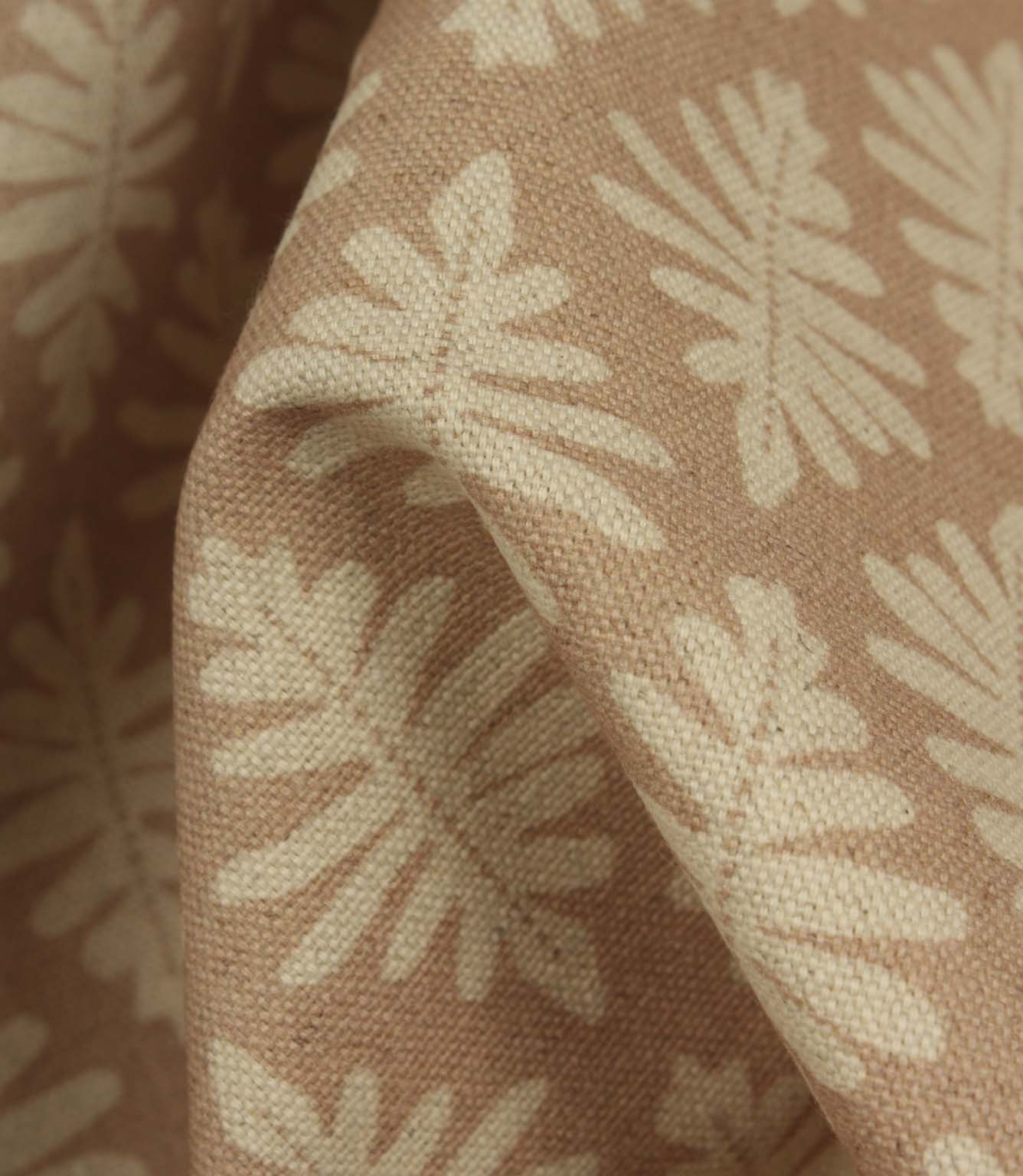 Detailed close-up of Ashleaf Tuskan Pink fabric emphasising the woven construction, texture and cream leaf pattern.