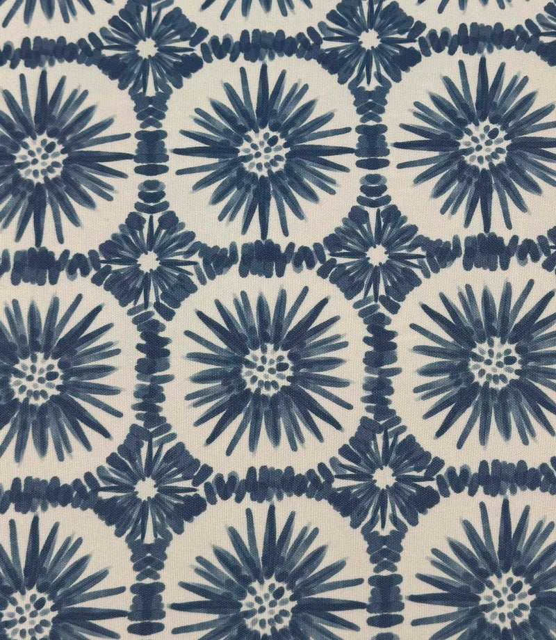 Full repeat view of Atlantic Flower foliage outdoor fabric with indigo blue floral patterns arranged in a structured geometric layout on a cream backdrop.