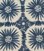 Close-up of Atlantic Flower geometric foliage fabric with deep blue botanical shapes and repeating floral forms on a light neutral base.