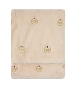 Folded natural cream Autumn Pumpkins faux fur throw with a soft plush texture and scattered beige, white and brown embroidered pumpkin motifs.
