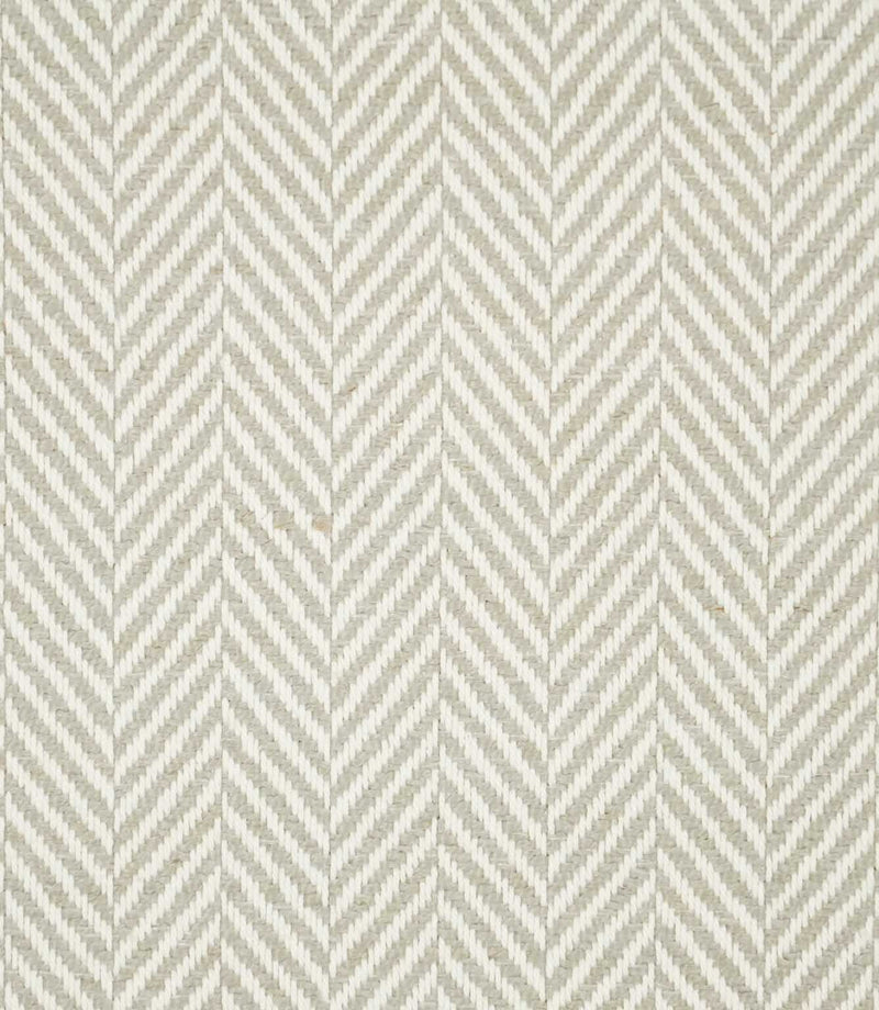 Bampton Argent herringbone fabric close-up, showing a soft grey-beige and off-white woven chevron pattern with clearly visible yarn texture.