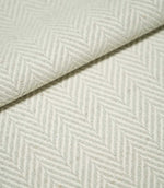 Close-up of folded Bampton Elephant Grey herringbone fabric, showing the soft grey and off-white chevron pattern, woven texture and substantial finish.