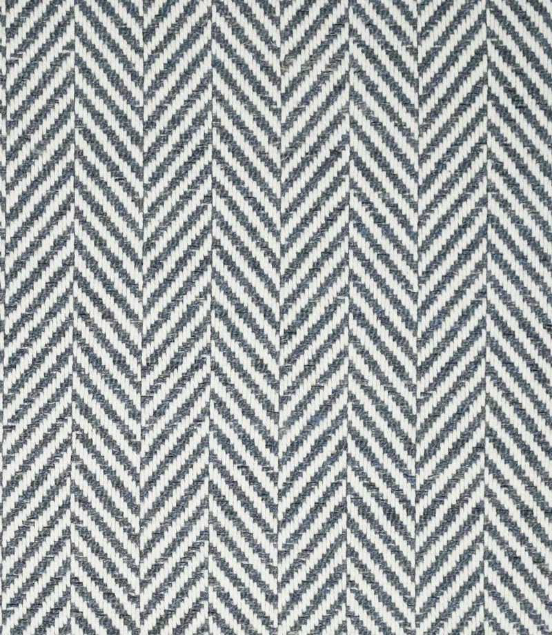 Bampton Ink herringbone fabric close-up, showing a dark navy blue and off-white woven chevron pattern with a clearly defined textured finish.