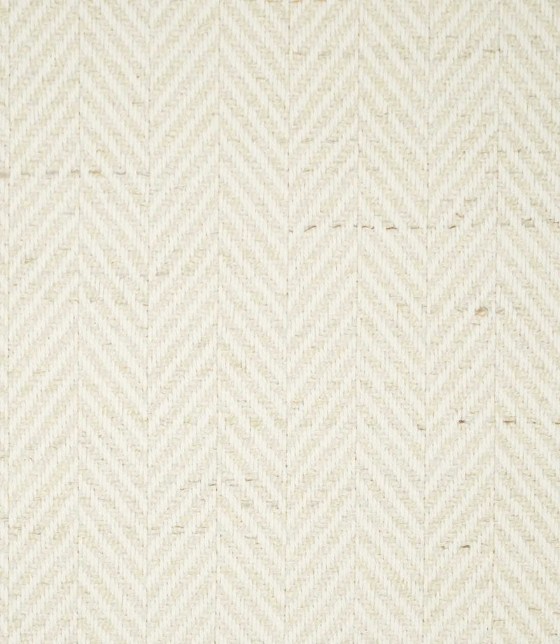 Bampton Jasmine herringbone fabric close-up, showing the soft cream woven surface with subtle natural flecks and a tonal chevron texture.