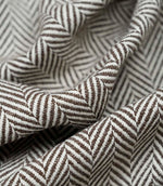 Close-up detail of Bampton Bison upholstery fabric highlighting the woven herringbone texture, fabric construction and premium quality finish.