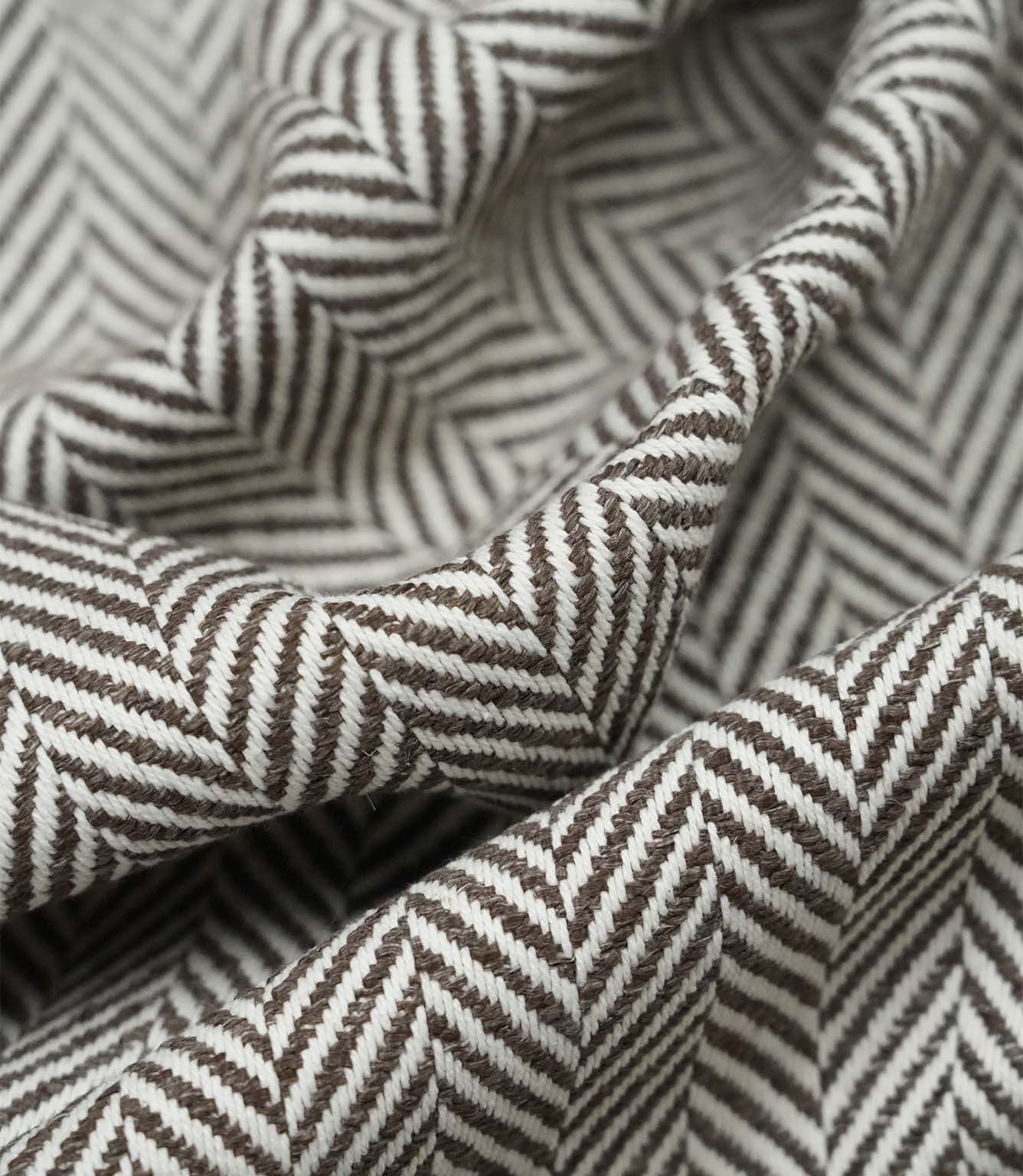 Close-up detail of Bampton Bison upholstery fabric highlighting the woven herringbone texture, fabric construction and premium quality finish.