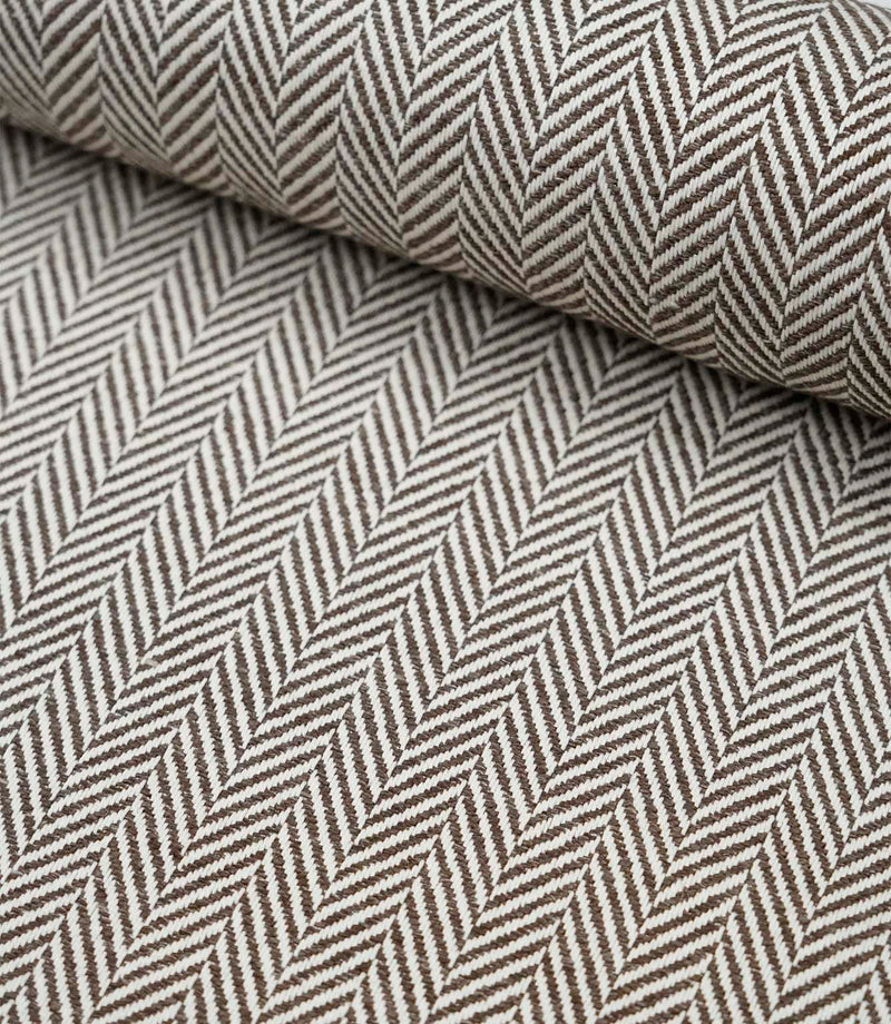 Wide view of Bampton Bison woven herringbone fabric displaying the continuous chevron pattern across the fabric width.