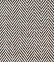 Close-up of Bampton Bison upholstery fabric highlighting the textured woven herringbone design and premium finish in brown and ivory.