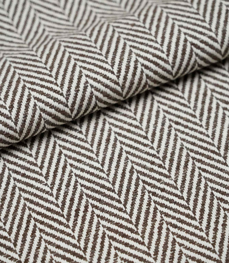 Folded Bampton Bison woven herringbone fabric displaying the soft texture, fabric weight and classic chevron pattern.
