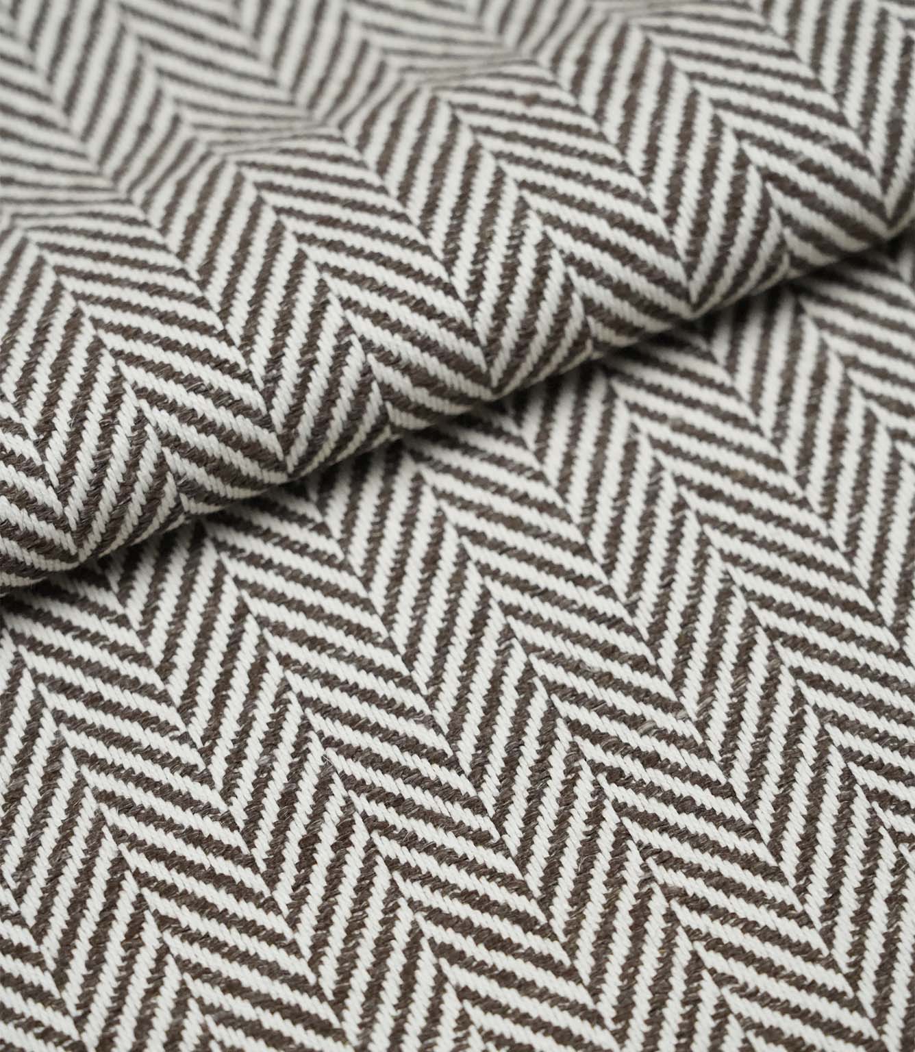 Folded Bampton Bison woven herringbone fabric displaying the soft texture, fabric weight and classic chevron pattern.
