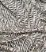 Draped Bampton Bison woven herringbone fabric demonstrating its soft handle, natural drape and suitability for curtains, blinds and cushions.