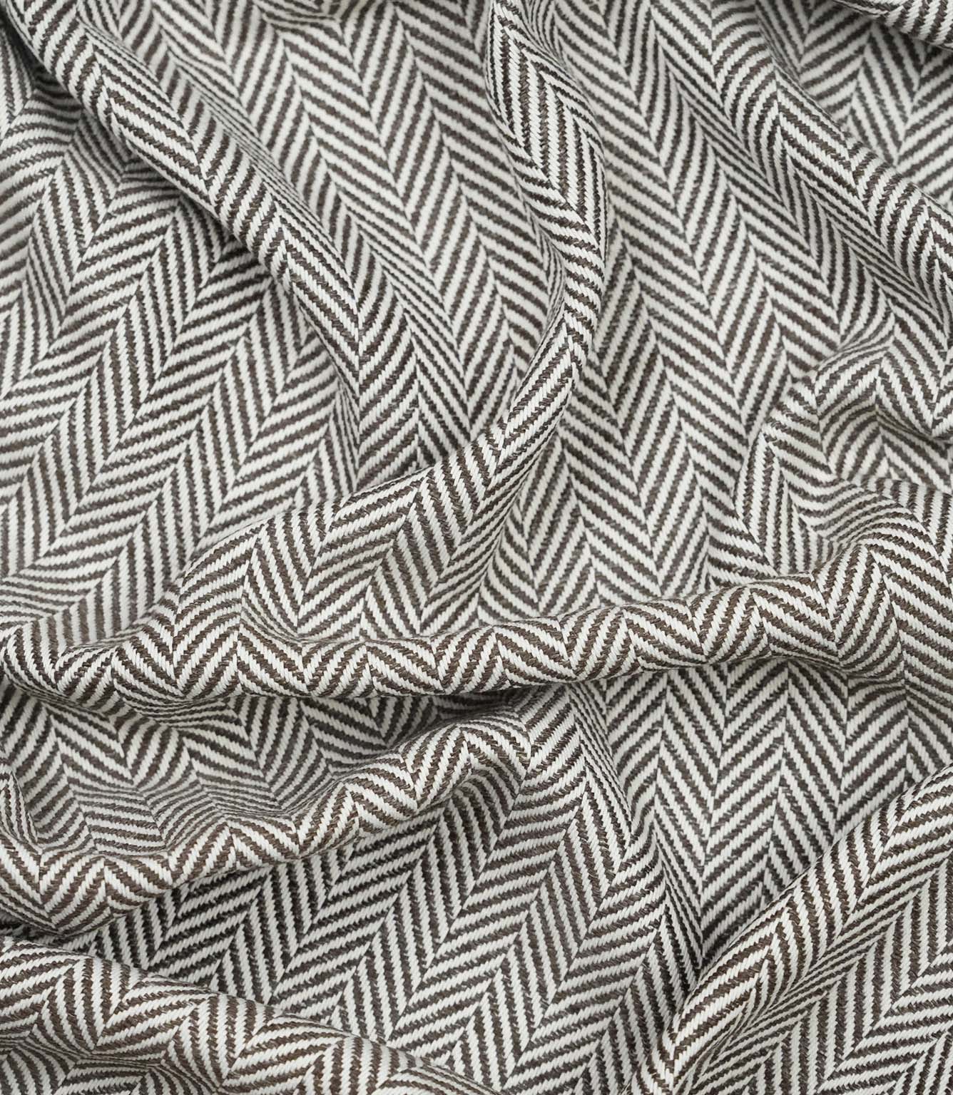 Draped Bampton Bison woven herringbone fabric demonstrating its soft handle, natural drape and suitability for curtains, blinds and cushions.