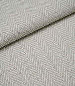 Folded Bampton Elephant Grey upholstery fabric displaying the woven herringbone chevron pattern and durable textured finish, ideal for curtains and upholstery.