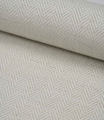Rolled Bampton Elephant Grey upholstery fabric featuring a woven herringbone chevron pattern in elephant grey and ivory, ideal for curtains, blinds and upholstery projects.