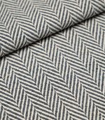 Folded Bampton Ink upholstery fabric showcasing the woven herringbone chevron pattern and durable textured finish, suitable for curtains and upholstery.