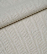 Folded Bampton Jasmine woven fabric showing its soft texture and classic herringbone design.